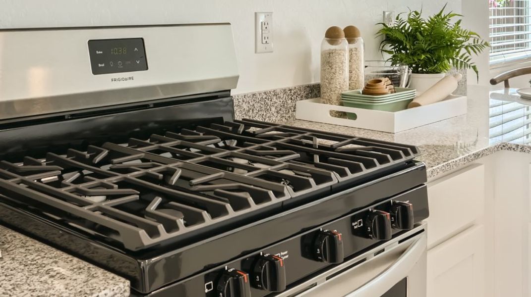 Close up of the five-burner gas stovetop