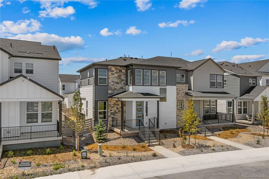 Front exterior of a new home in Duet at Sterling Ranch, Littleton, CO, highlighting curb appeal (Image 1).