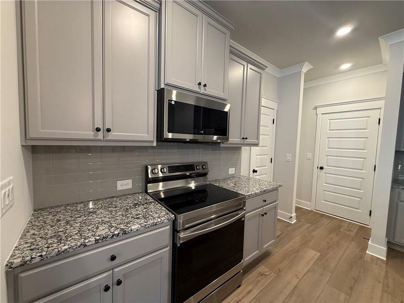 Furnished interior view inside a new home in The Towns at Auburn Station East, Auburn (Image 5).