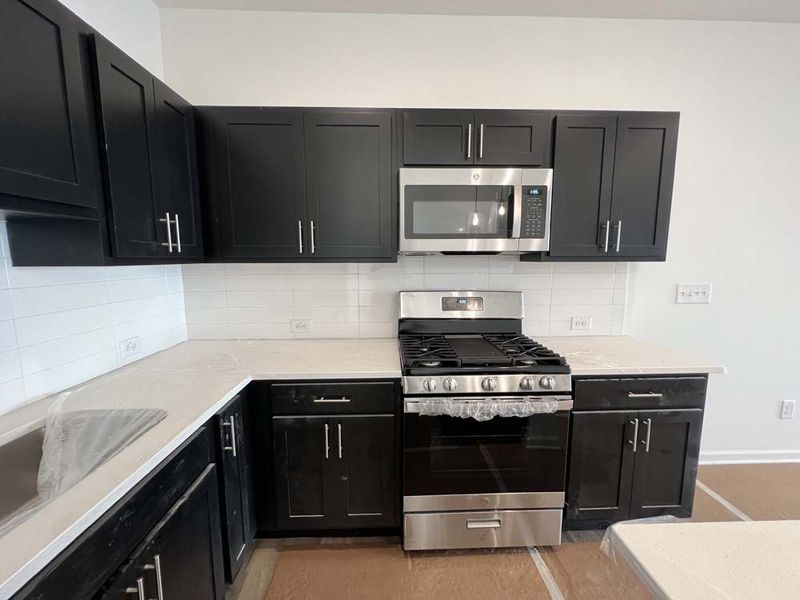 Kitchen featuring Industrial Collection Finishes Construction Progress