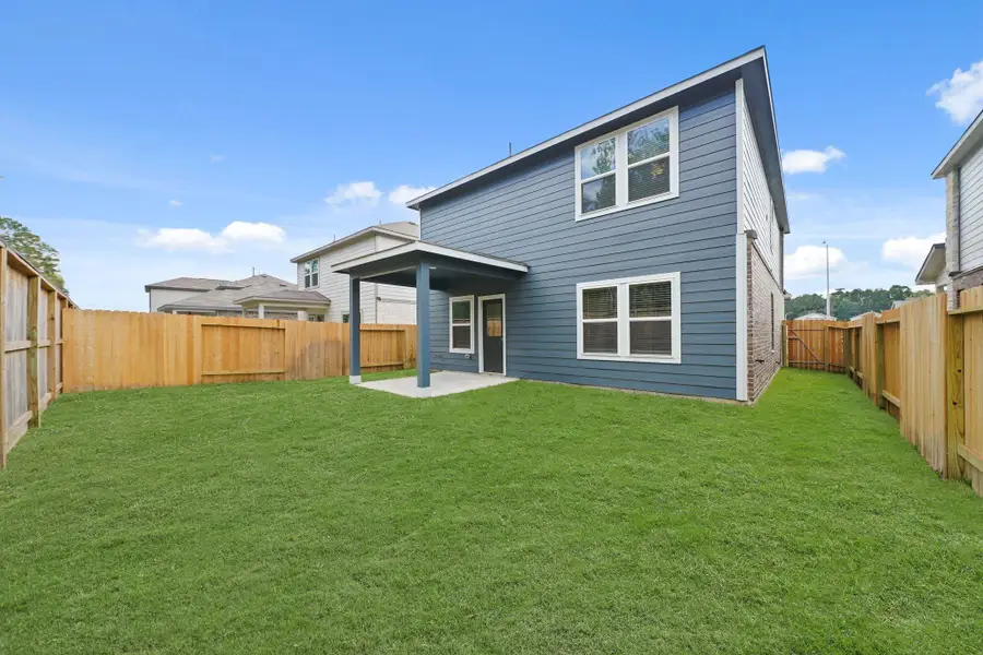 Exterior details and patio area of a home in Lakes at Black Oak, Magnolia (Image 4).