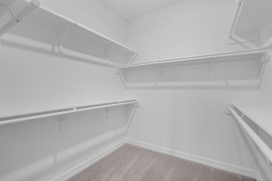 A view of your large primary walk-in Closet