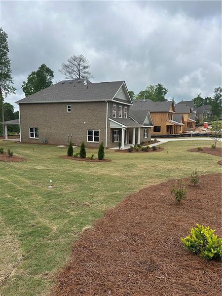 Exterior details and patio area of a home in Mirror Lake at South Harbour, Villa Rica (Image 27).