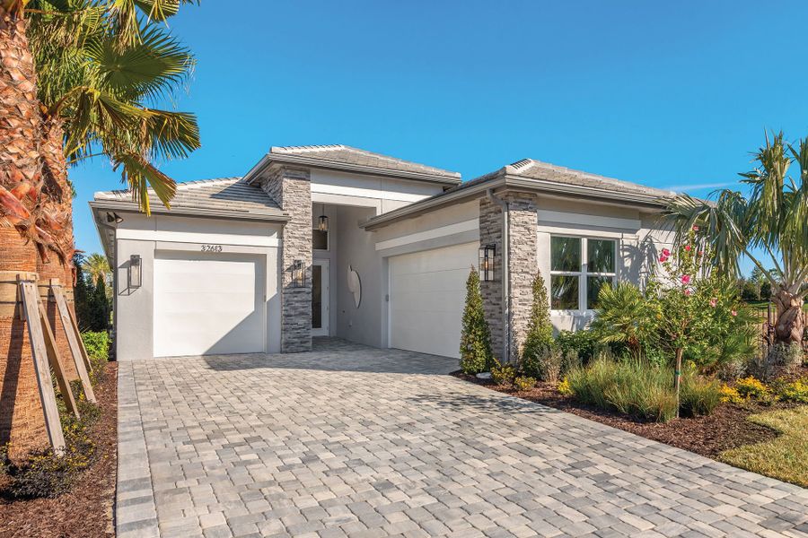 Representative exterior photo of a completed home built from the Elena by GL Homes in Valencia Ridge, Wesley Chapel, FL (Image 2). Representative exterior photo of a completed home built from the Elena by GL Homes in Valencia Ridge, Wesley Chapel, FL (Image 2).