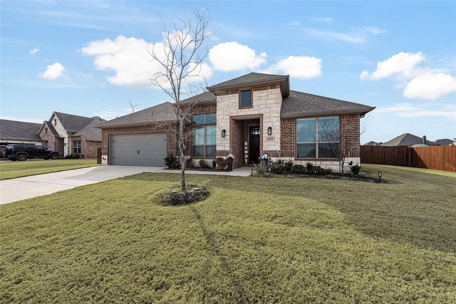 Front exterior of a new home in Coyote Crossing, Godley, TX, highlighting curb appeal (Image 21).