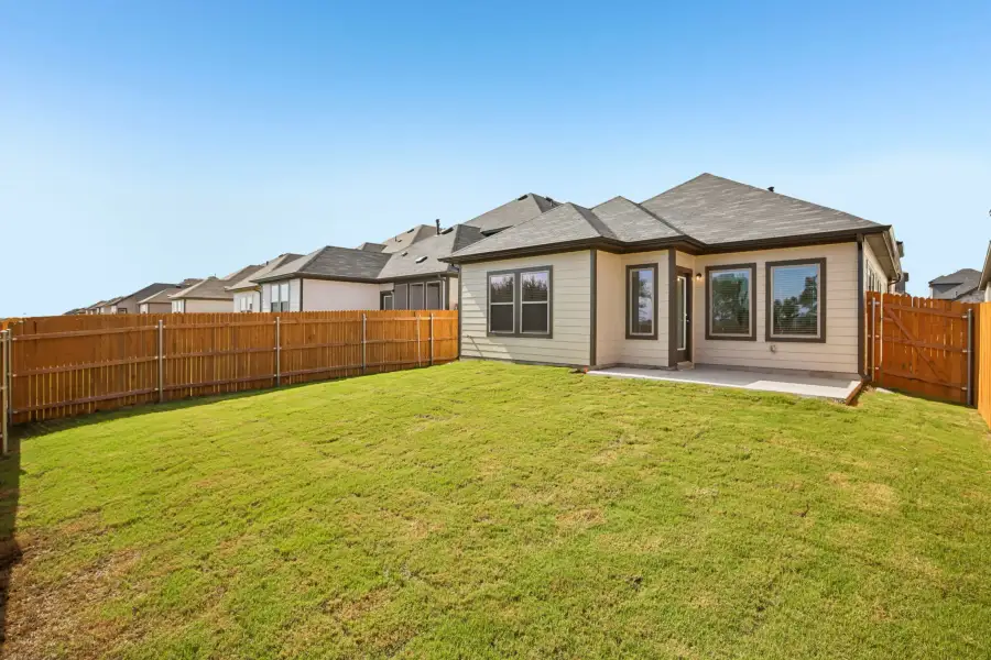 Exterior details and patio area of a home in Trinity Ranch, Elgin (Image 20).