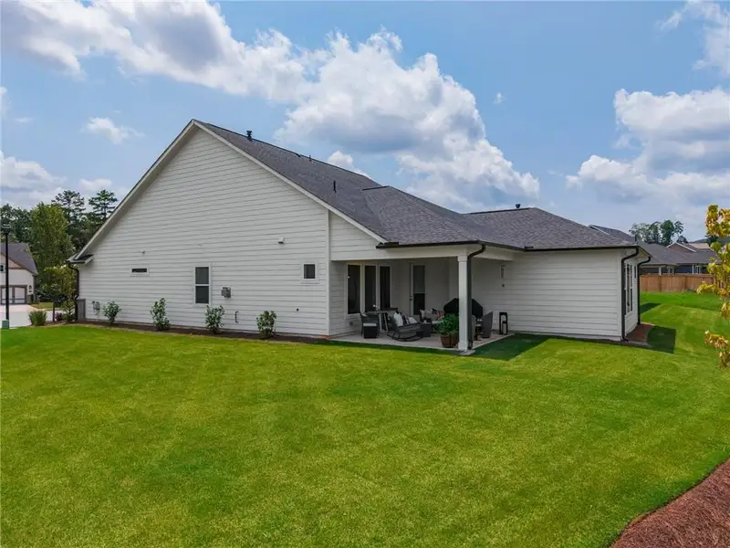 Exterior details and patio area of a home in Crescent Pointe at Great Sky, Canton (Image 21).