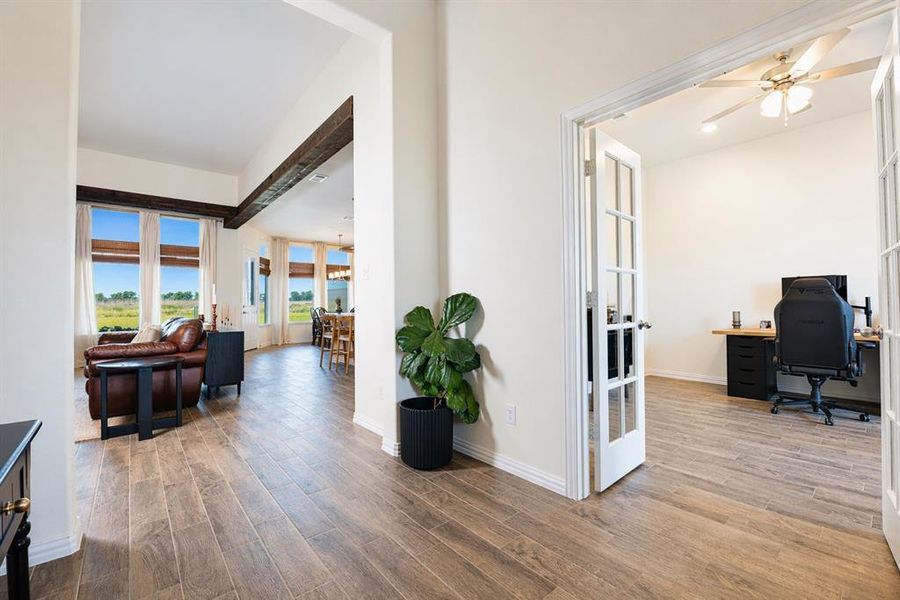 Inviting entryway featuring wood-finish flooring extending throughout