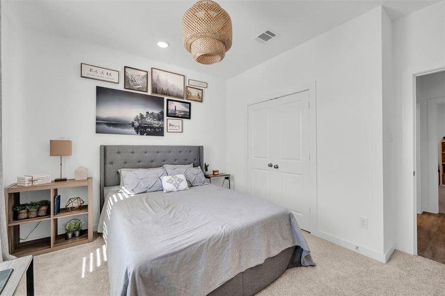 Bedroom featuring a closet and light carpet