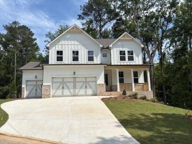 Front exterior of a new home in Riverwood, Dallas, GA, highlighting curb appeal (Image 99). Front exterior of a new home in Riverwood, Dallas, GA, highlighting curb appeal (Image 99).
