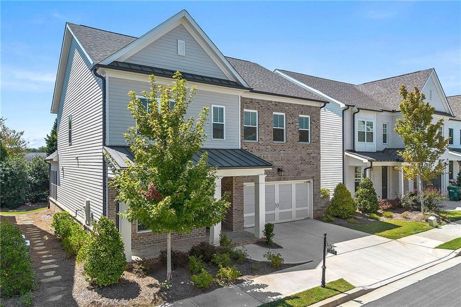Front exterior of a new home in , Duluth, GA, highlighting curb appeal (Image 22).