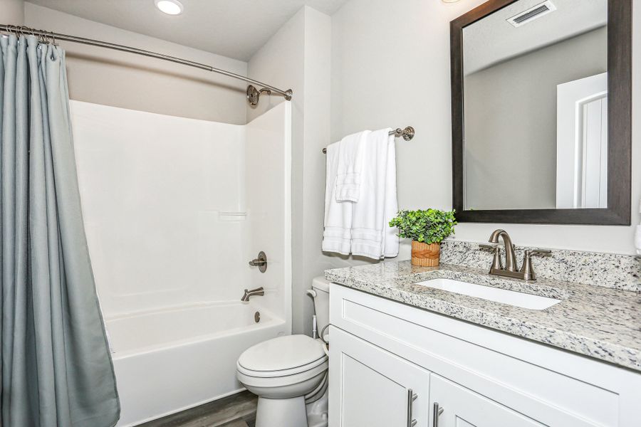 Representative furnished interior of a home built from the The Carlos by Herbst Homes in Doyle Hawkins Landing, Navarre (Image 77).