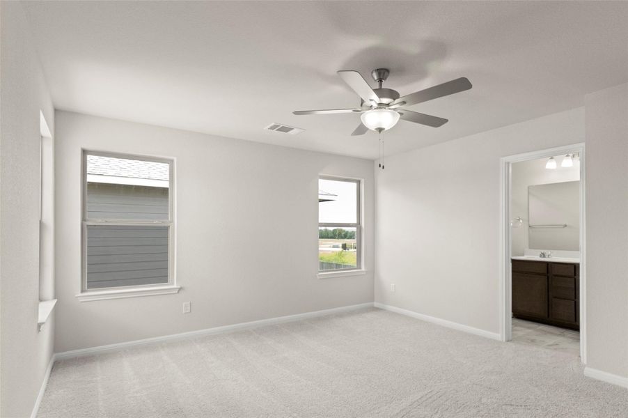 Unfurnished bedroom with light colored carpet, ensuite bathroom, and a ceiling fan