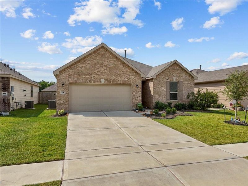 Front exterior of a new home in , Alvin, TX, highlighting curb appeal (Image 2).