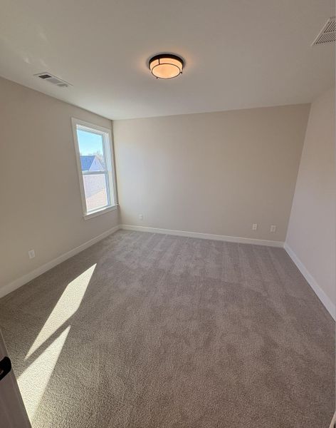 Spare room with carpet flooring and baseboards