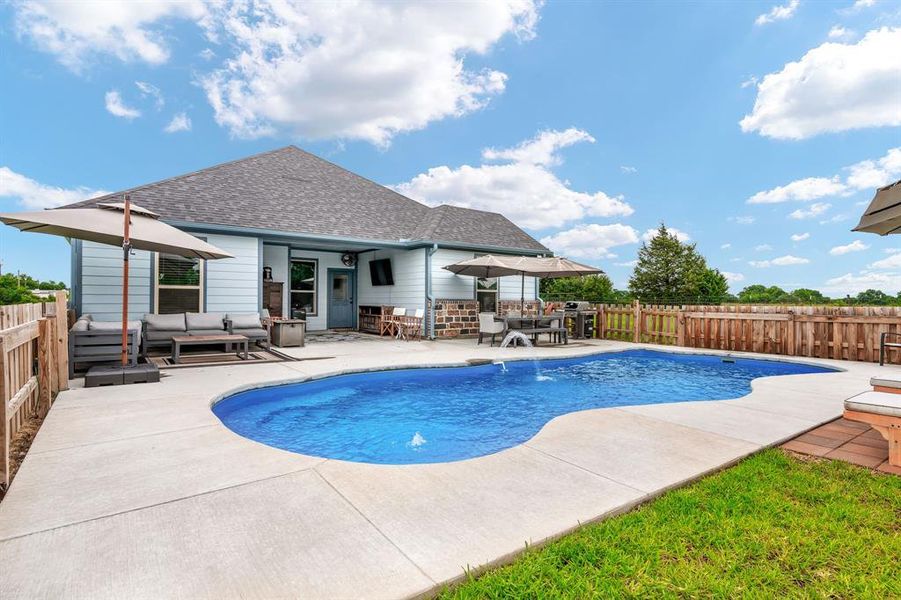 Alternate View of Pool looking toward the patio. Lots of room for additional chairs for lounging around the pool.