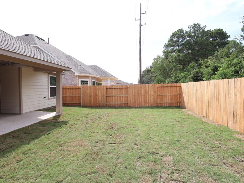 Front exterior of a new home in Sorella, Tomball, TX, highlighting curb appeal (Image 21). Front exterior of a new home in Sorella, Tomball, TX, highlighting curb appeal (Image 21).