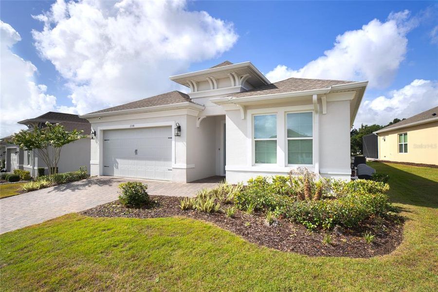 Front exterior of a new home in , Kissimmee, FL, highlighting curb appeal (Image 2). Front exterior of a new home in , Kissimmee, FL, highlighting curb appeal (Image 2).