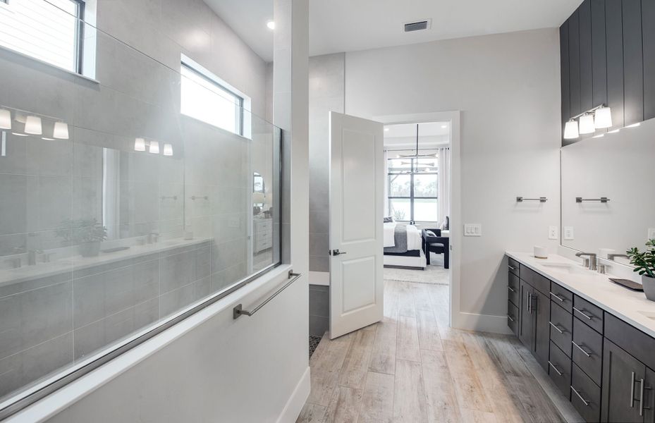 Walk-in shower located in owner's bath