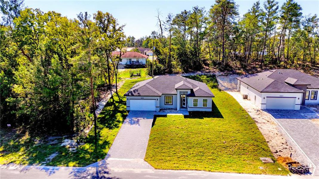 Front exterior of a new home in , Ocala, FL, highlighting curb appeal (Image 13).