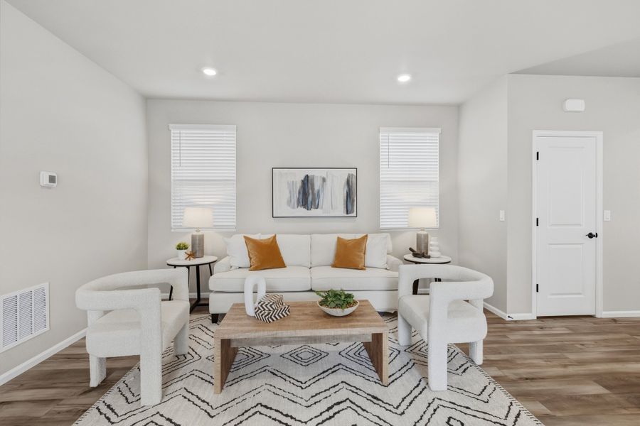 Furnished interior view inside a new home in Woodrose at Painted Prairie, Aurora (Image 8).
