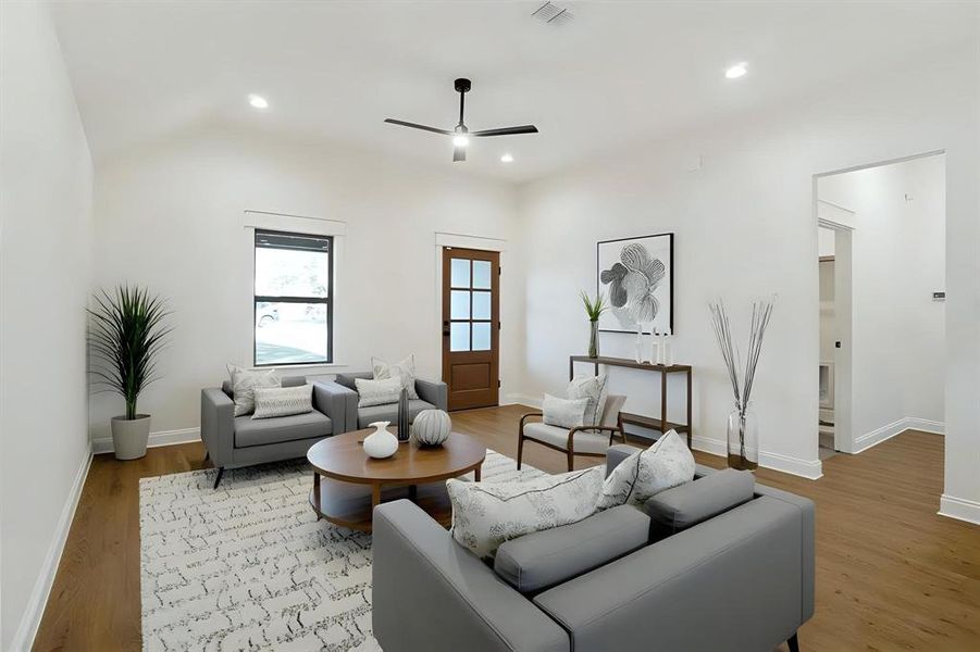 Living area featuring recessed lighting, light wood-style floors, and ceiling fan