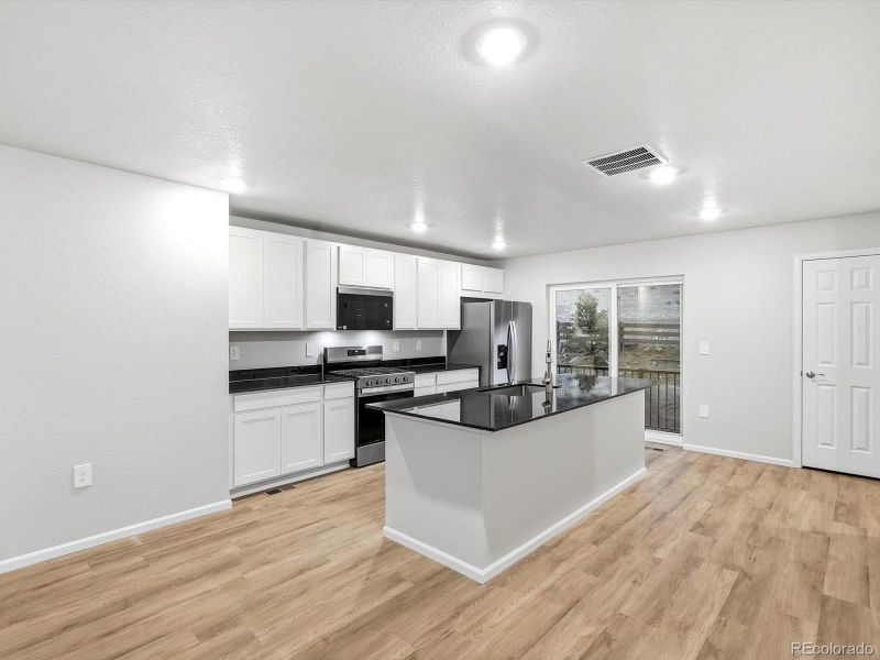 Furnished interior view inside a new home in Three Hills, Morrison (Image 9).