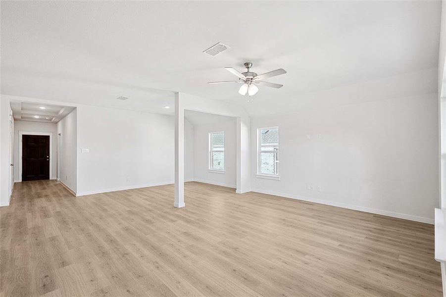 Spare room featuring light hardwood / wood-style flooring and ceiling fan