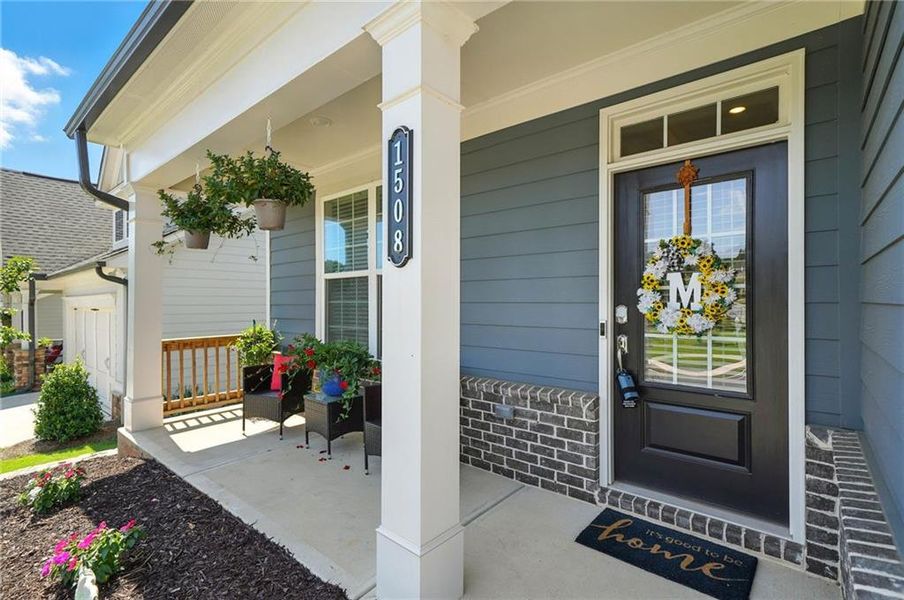 Front exterior of a new home in Hickory Bluffs, Canton, GA, highlighting curb appeal (Image 23). Front exterior of a new home in Hickory Bluffs, Canton, GA, highlighting curb appeal (Image 23).