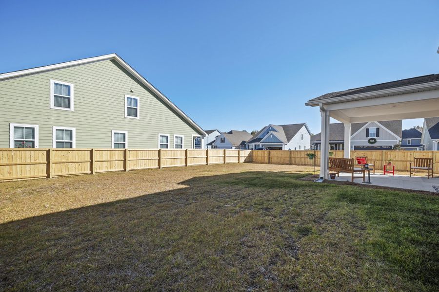 Exterior details and patio area of a home in High Point at Foxbank, Moncks Corner (Image 25).