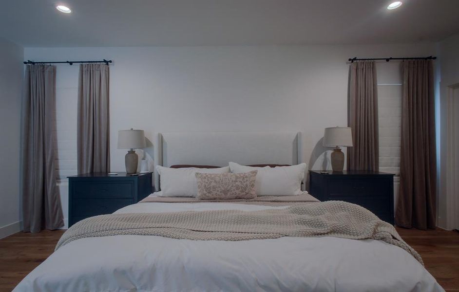 Bedroom with dark wood-type flooring