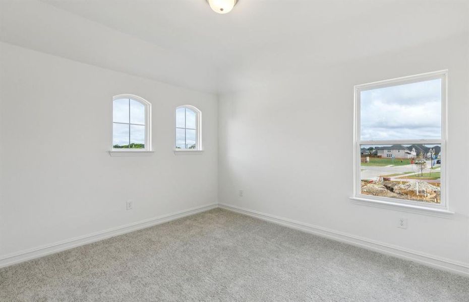 Spacious secondary bedroom with large windows