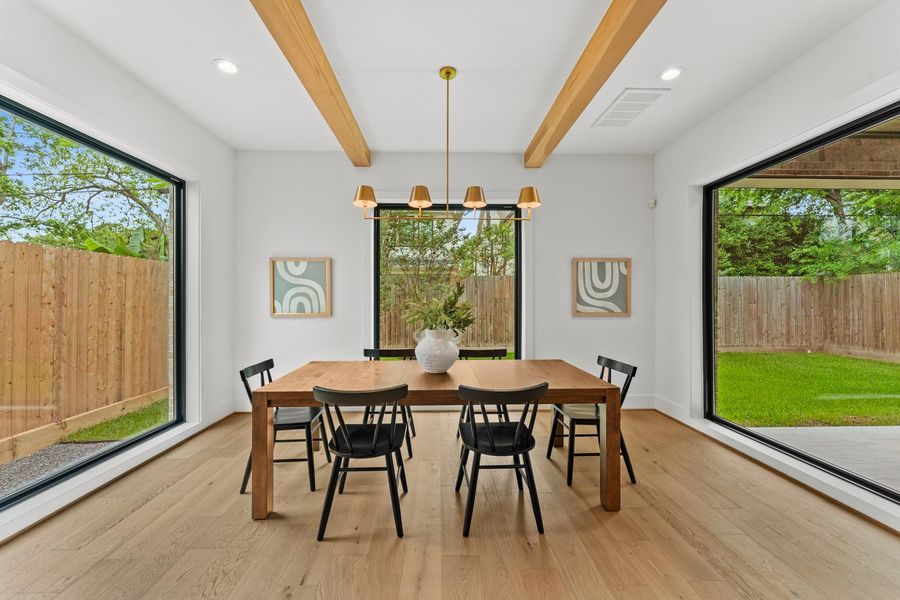 Breakfast room with backyard views