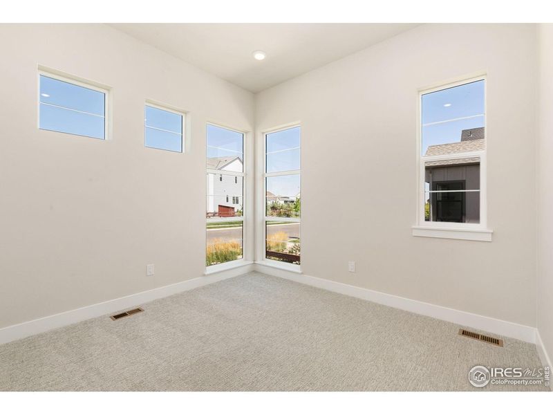 Spacious, unfurnished interior of a new home in Festival at RainDance, Windsor (Image 11).