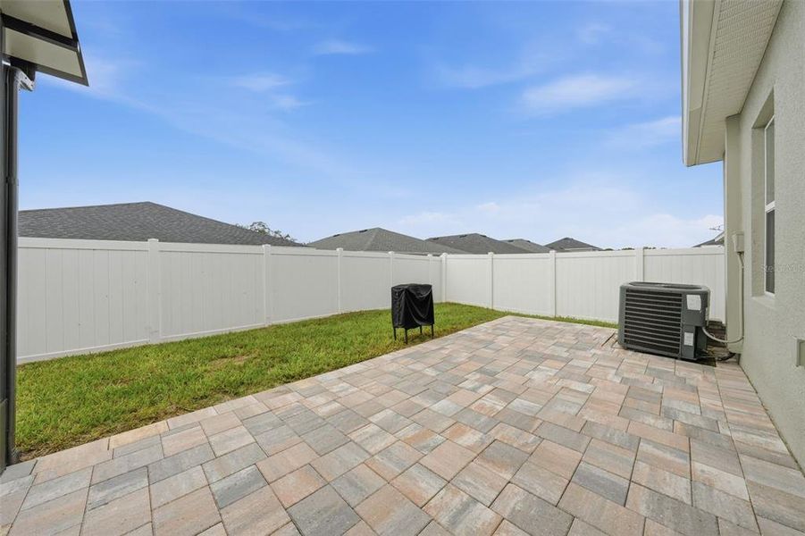 Exterior details and patio area of a home in Geneva Landings, Davenport (Image 3).
