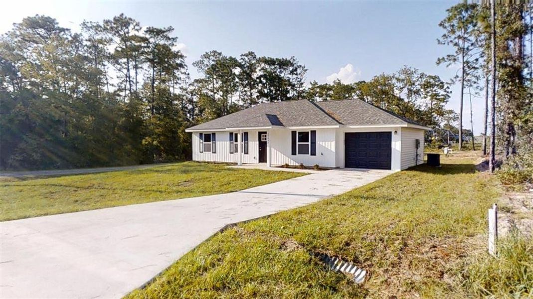 Front exterior of a new home in , Dunnellon, FL, highlighting curb appeal (Image 1). Front exterior of a new home in , Dunnellon, FL, highlighting curb appeal (Image 1).