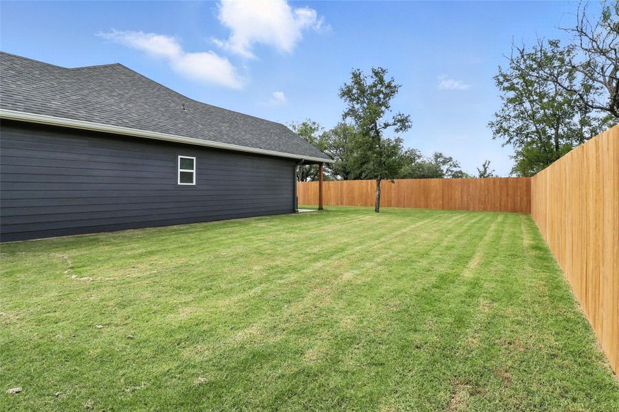 View of fenced backyard