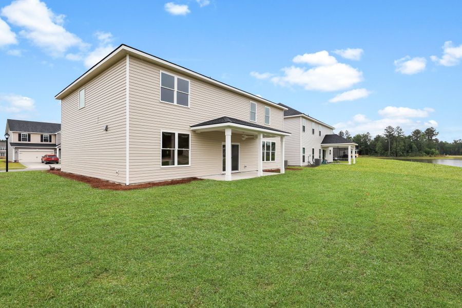 Front exterior of a new home in Camden Crossing, Savannah, GA, highlighting curb appeal (Image 2). Front exterior of a new home in Camden Crossing, Savannah, GA, highlighting curb appeal (Image 2).
