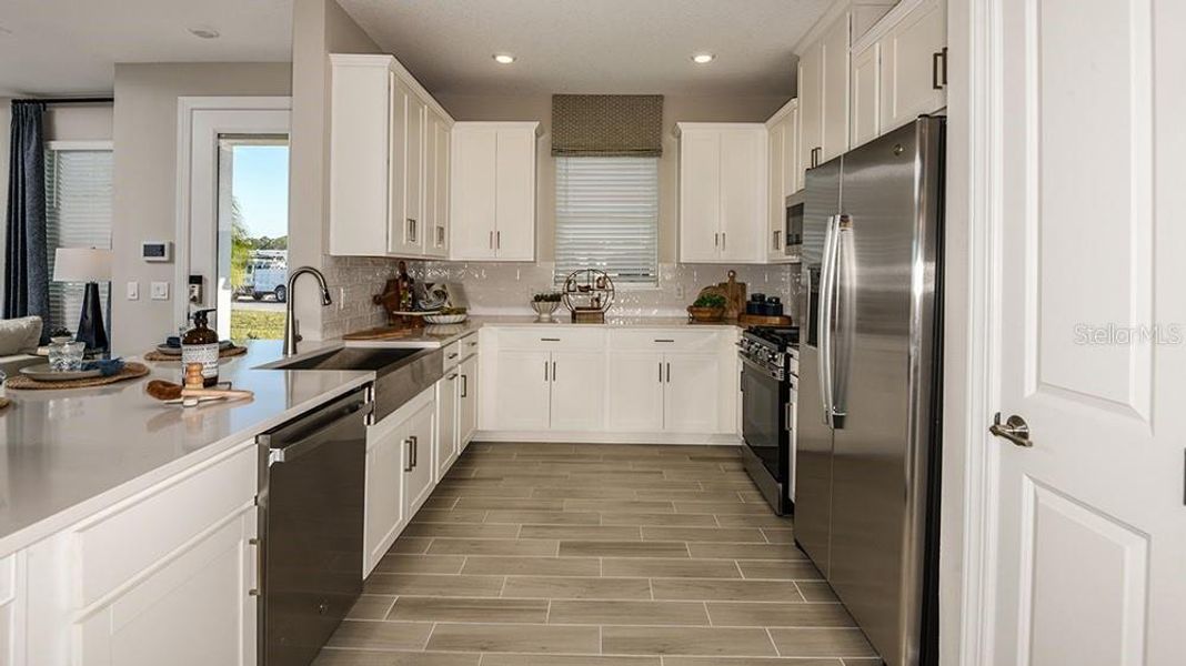 Furnished interior view inside a new home in Esplanade at McKinnon Groves, Winter Garden (Image 10).