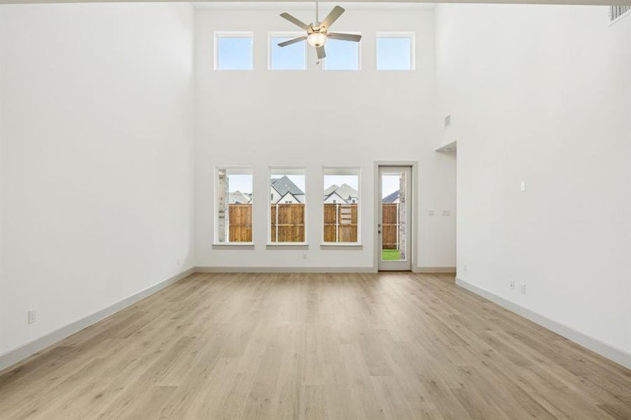 Your new family room is flooded with natural light from a dual stacked wall of windows! Your new family room is flooded with natural light from a dual stacked wall of windows!