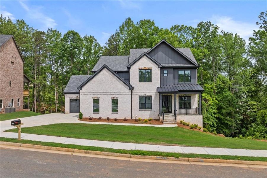 Front exterior of a new home in , Buford, GA, highlighting curb appeal (Image 25).