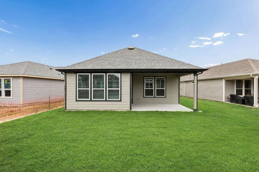 Exterior details and patio area of a home in Del Webb in Chambers Creek, Willis (Image 3).