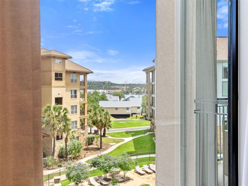 View from the primary bedroom of the lake and hill country. View from the primary bedroom of the lake and hill country.