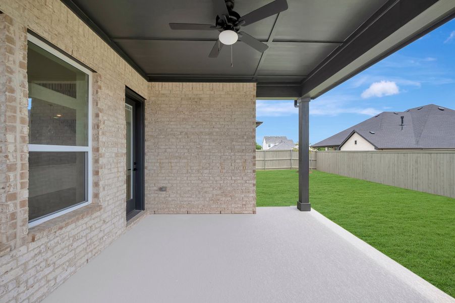 Exterior details and patio area of a home in Pecan Square – Classics, Northlake (Image 4).