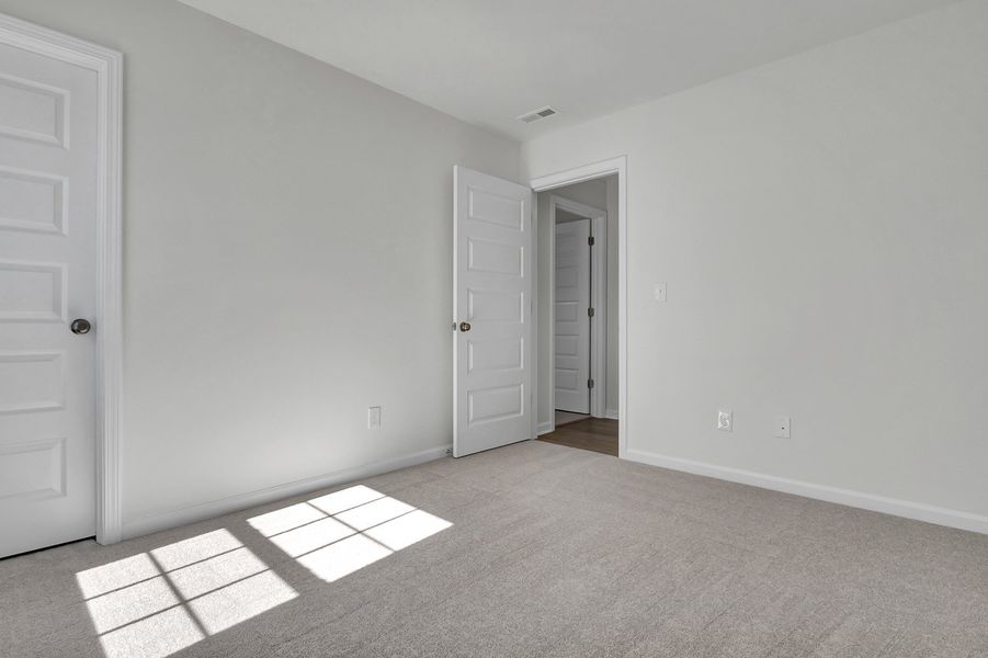 Spacious, unfurnished interior of a new home in Grand Park, Leland (Image 28). Spacious, unfurnished interior of a new home in Grand Park, Leland (Image 28).