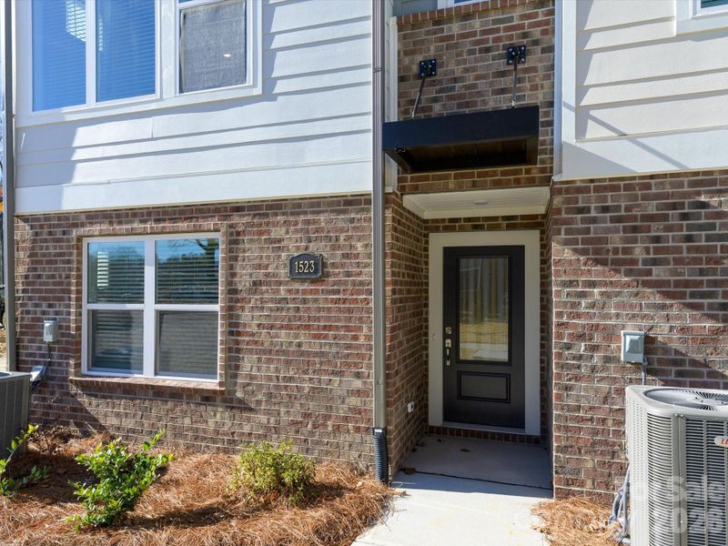 Exterior details and patio area of a home in Central Living at Craig, Charlotte (Image 19).