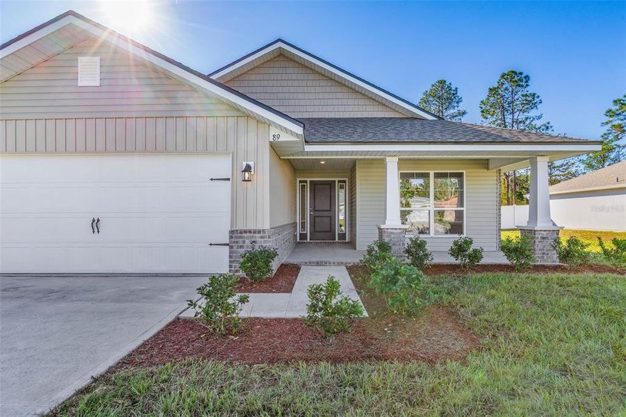 Front exterior of a new home in Palm Coast, Palm Coast, FL, highlighting curb appeal (Image 2).