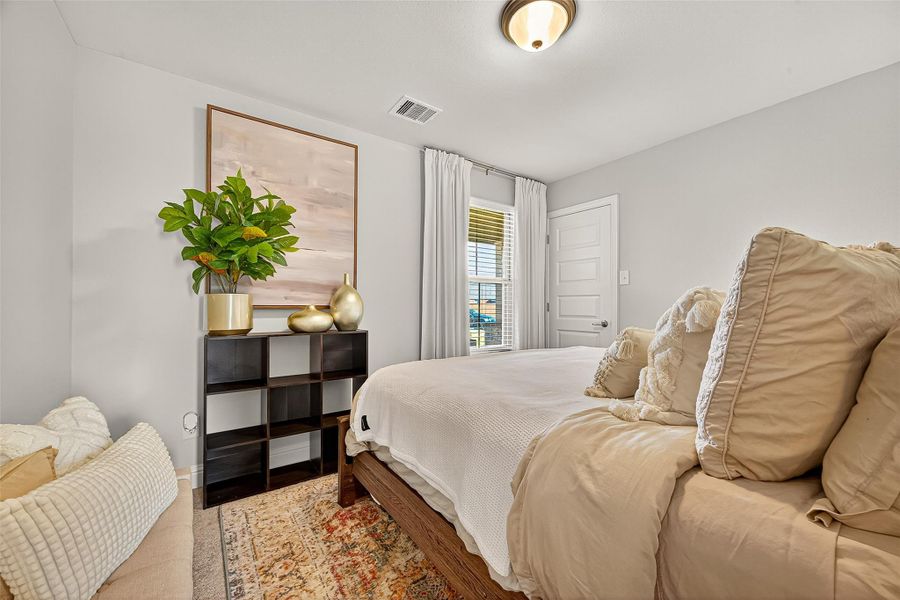 Furnished interior view inside a new home in Sunterra, Katy (Image 30).