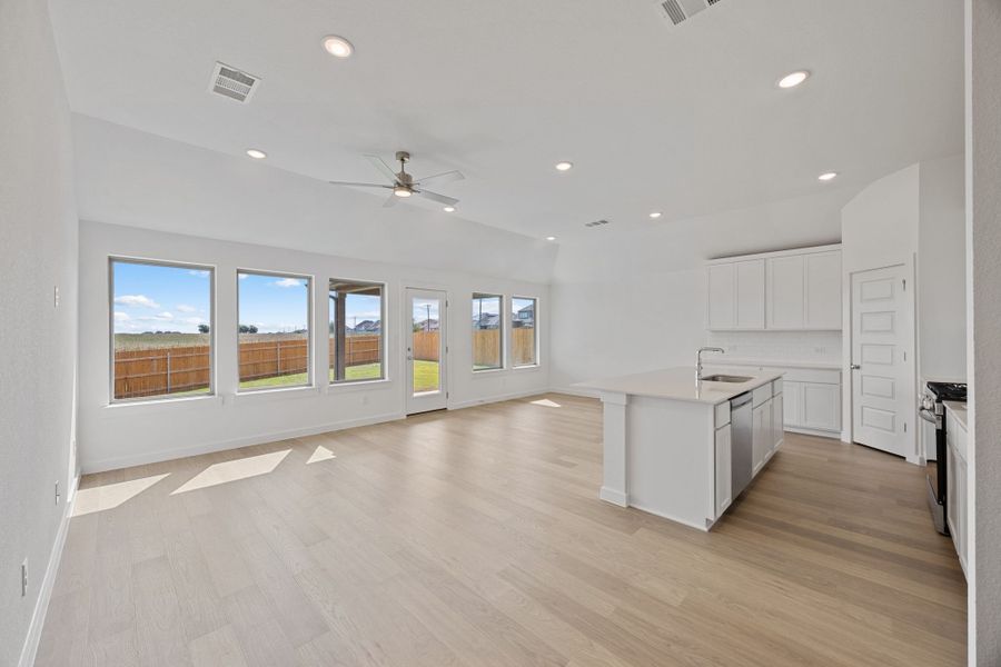 Open Living Space in the Colorado home plan by Trophy Signature Homes – REPRESENTATIVE PHOTO Open Living Space in the Colorado home plan by Trophy Signature Homes – REPRESENTATIVE PHOTO