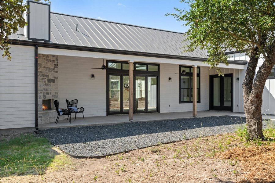 Private backyard retreat with a covered patio and tranquil greenbelt views.